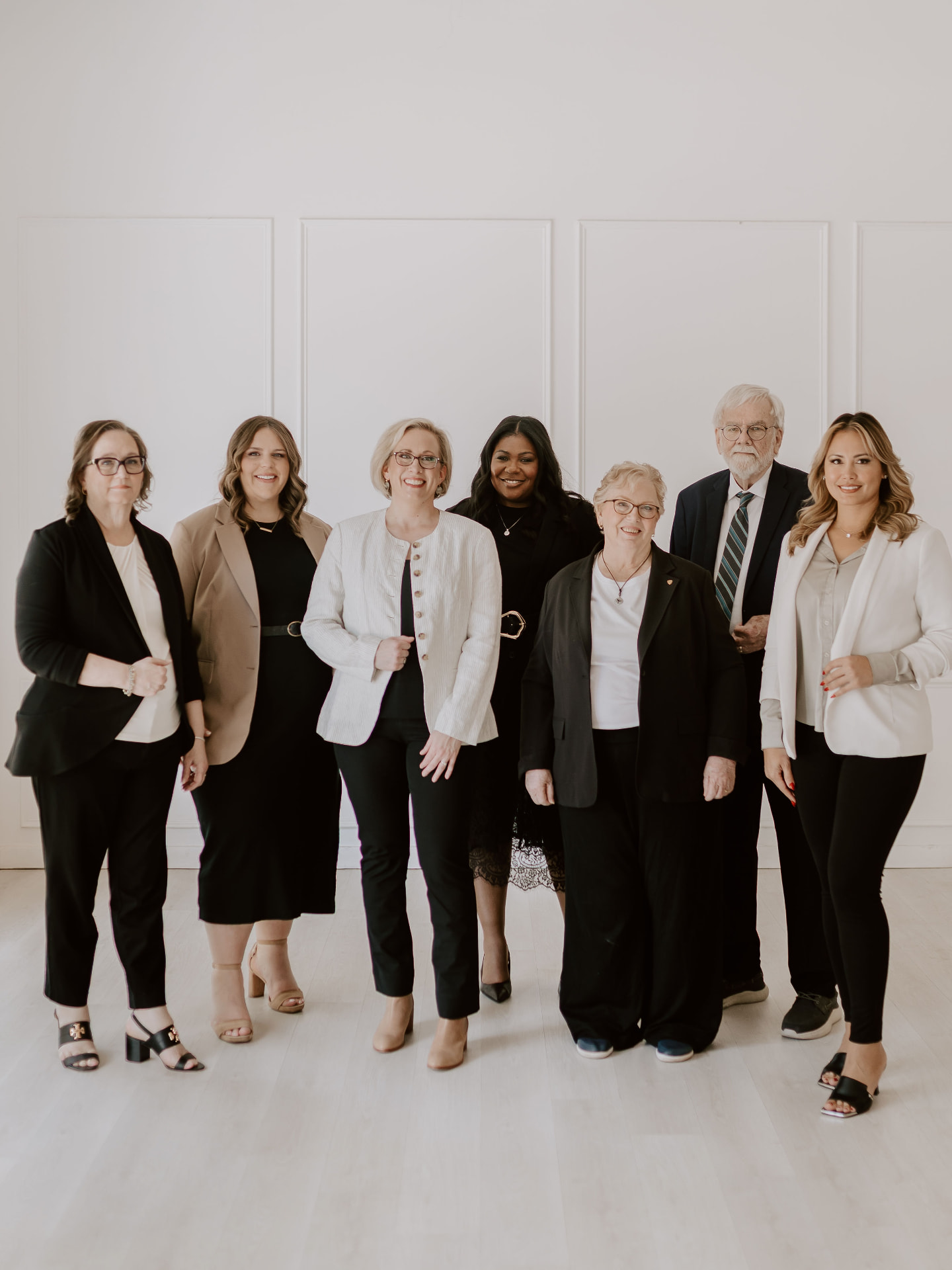 The full Jordan Consultants team standing together in business attire