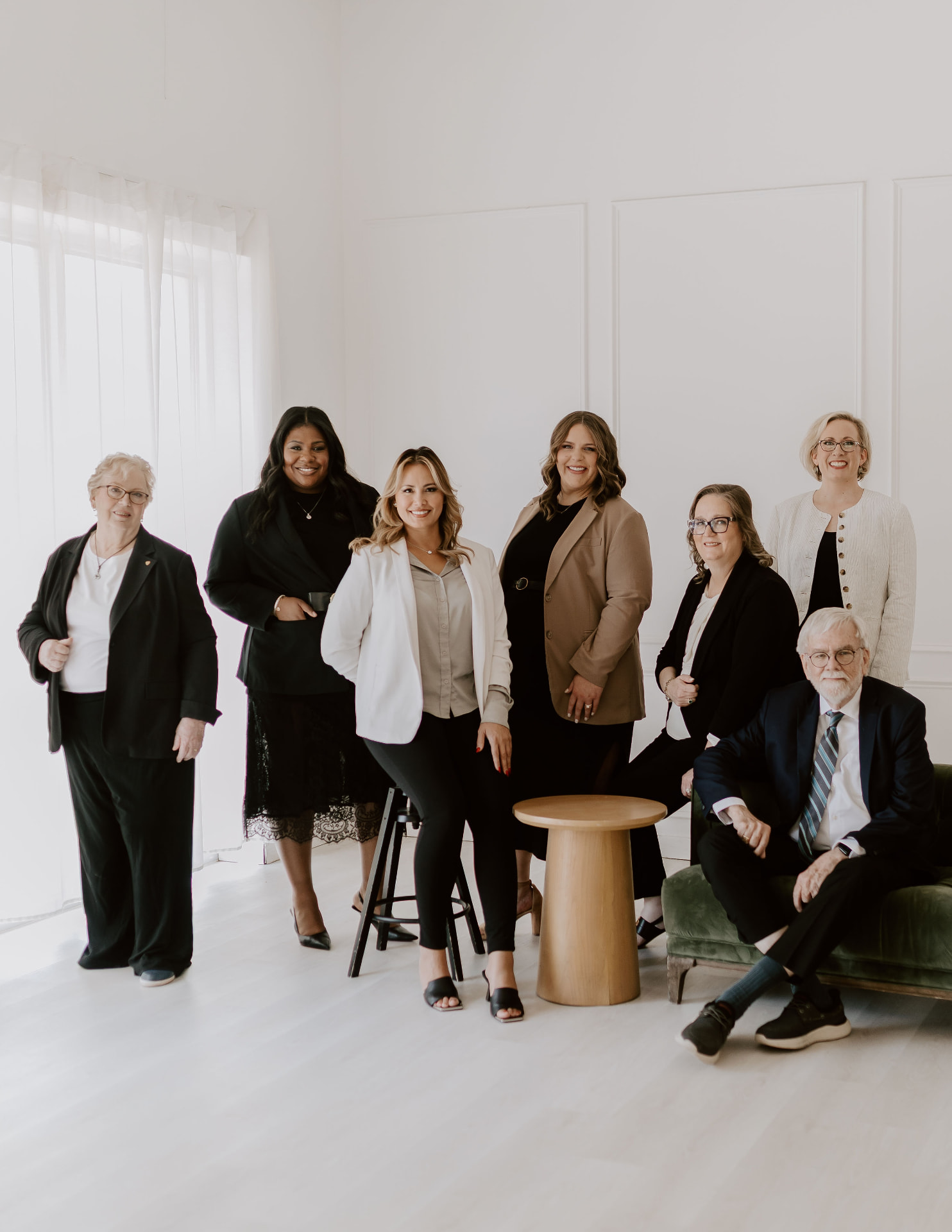 The Jordan Consultants team posed in a bright studio