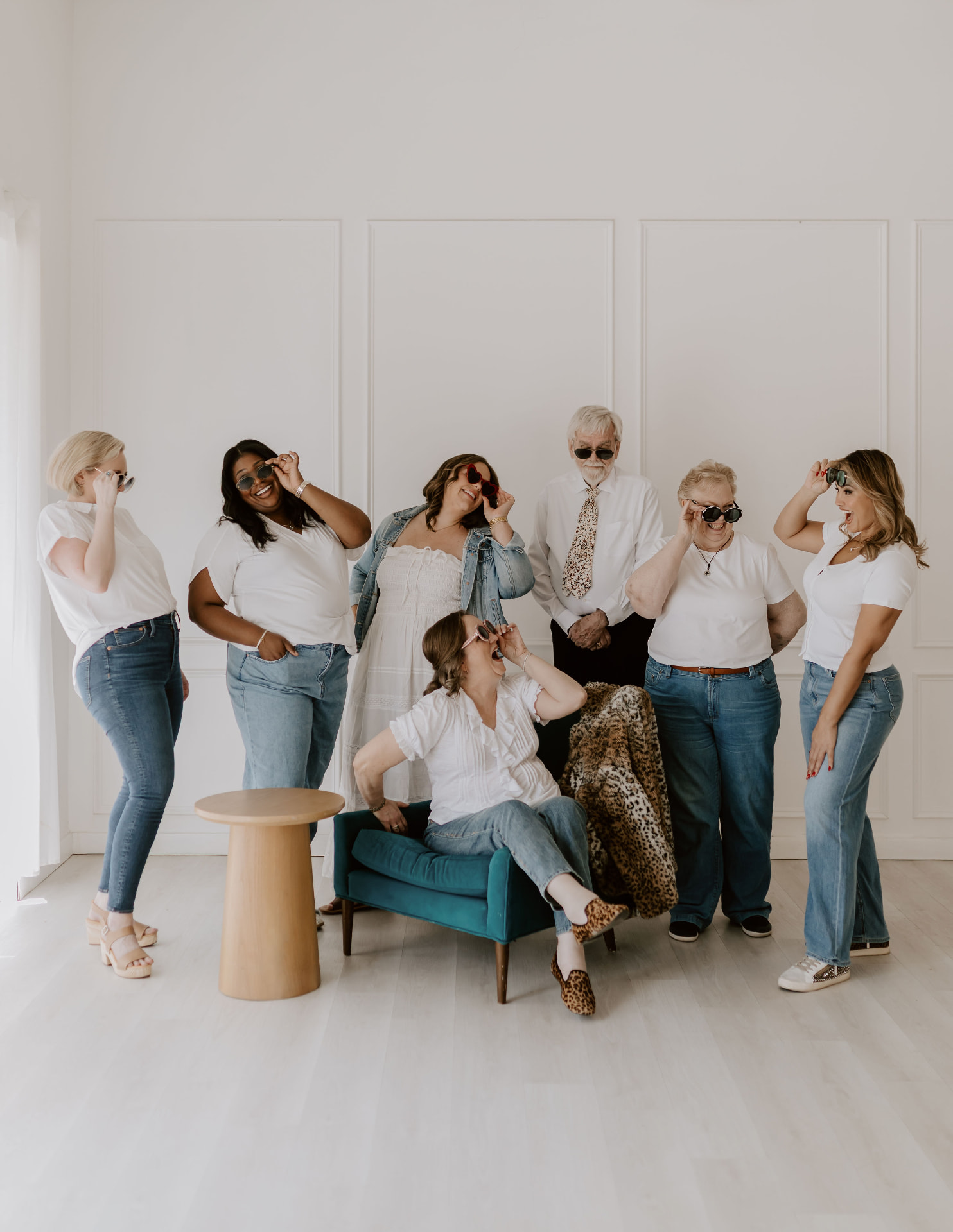 The Jordan Consultants team laughing together in sunglasses